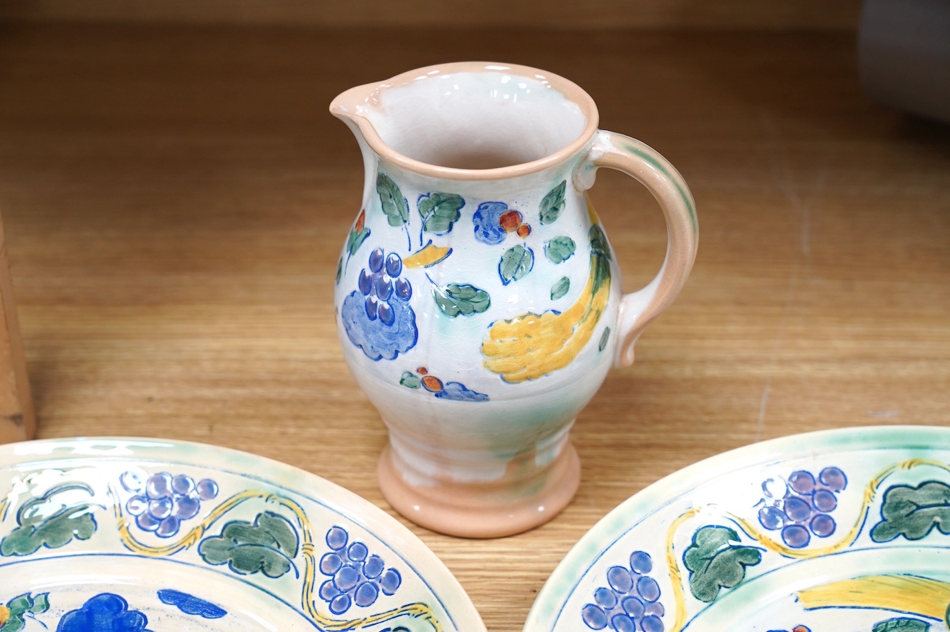 Royal Doulton, Frank Brangwyn design, a pair of chargers and a jug, 32.5cm diameter. Condition - good, crazing